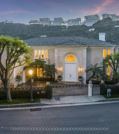 a house with trees and a fence
