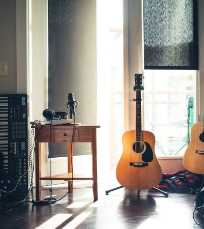 homes for sale with recording studio several guitars beside of side table