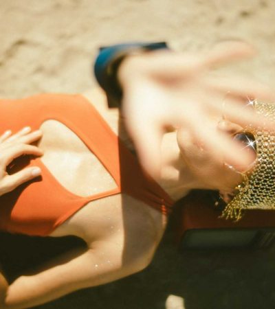 paparazzi proof homes for sale woman in orange dress lying on ground