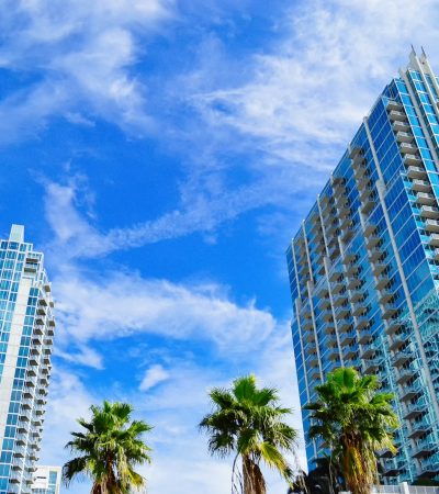 brentwood condos for sale green palm trees near high rise buildings under blue sky during daytime