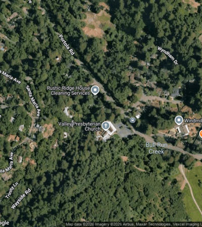 Elegant luxury home exterior in Portola Valley, CA with sophisticated architecture and manicured landscaping