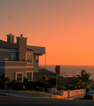 Playa del Rey white and brown concrete building near green trees during sunset