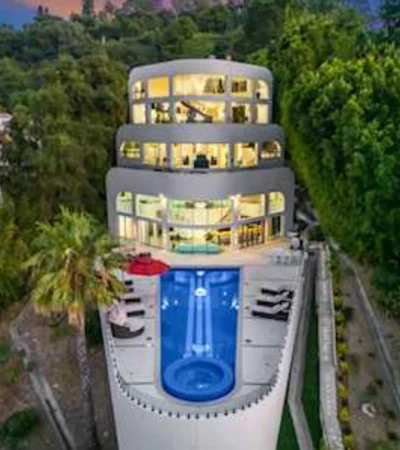 a building with a pool and trees