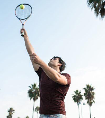 Upscale tennis club resort with palm trees and luxury amenities in Palm Springs