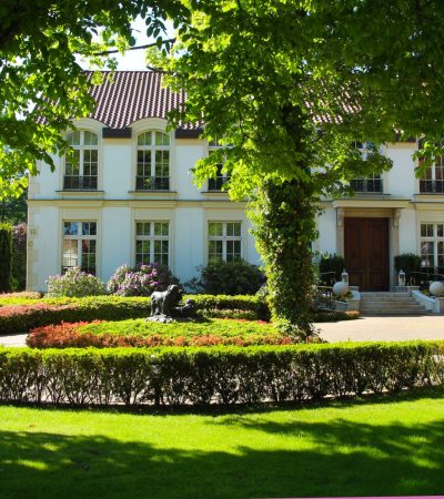 Elegant classic Beverly Hills luxury home with timeless architectural design and manicured grounds