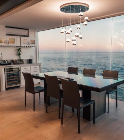 luxury homes for sale in malibu ca  dining table set placed beside glass window