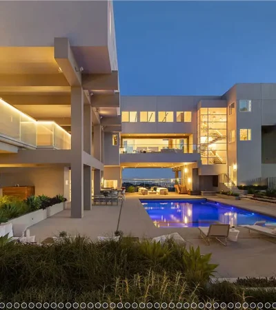 a pool in front of a house