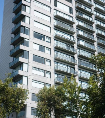 Luxury villa condo building exterior in Los Angeles with modern architecture and landscaping