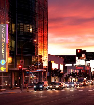 a street with cars and a building