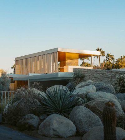 brown wooden mid century house near green trees during daytime